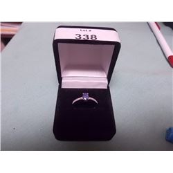 RING - OVAL FACETTED BLUE SAPPHIRE SOLITAIRE WITH 2 SHOULDER DIAMONDS IN STERLING SILVER SETTING - A