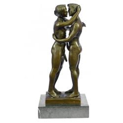 Two Gay Men Engaging In A Flirtatious Kiss Statue