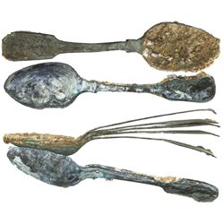 Two clumps of copper-alloy spoons (encrusted as found), 10 spoons total.