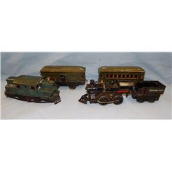 Toy train, 5 pcs., wind-up cast iron engine & tender car, and 3 tin passenger cars, not all matching