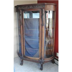 Oak curved glass china cabinet, curved door & panels, carved lions heads, oak shelves, very nice!