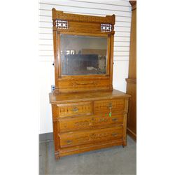 Oak spoon carved dresser with ornate spindle crown, beveled mirror, 78" h x 43" w