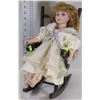 Image 1 : DECORATIVE PORCELAIN DOLL IN ROCKING CHAIR