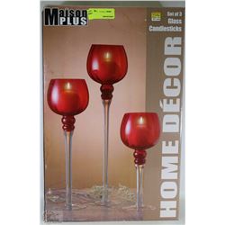SET OF THREE GLASS CANDLE STICKS