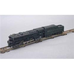 A Lionel '0' gauge locomotive No 671, fitted with smoke chamber, boxed, L 11ins, together with a...