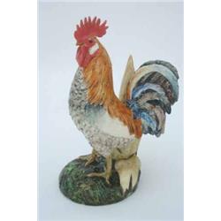 A Delphin Massier-Vallauris stoneware majolica figure, modelled as a cockerel standing against a...