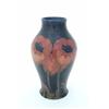 Image 1 : A large Moorcroft baluster-shaped poppy vase, with tube-lined poppy decoration, red on a dark-blu...