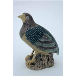 A 19th century famille vert model of a short-tailed bird, the wings painted in green and grey, wi...