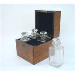 A Victorian burr-walnut decanter box, brass-bound, with hinged cover inset monogrammed cartouche...