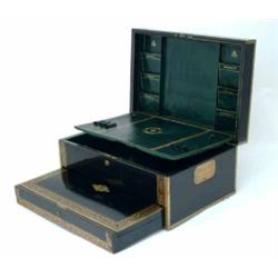 A George IV rosewood writing box, inlaid with cut-brasswork, the hinged lid inset shaped cartouch...