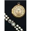 Image 1 : # A double string of baroque natural pearls, with ornate yellow and white metal serpent clasp, th...