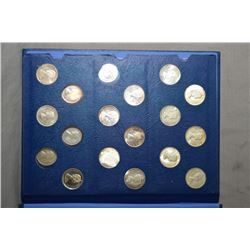 Selection of Canadian fifty cent coins dated 1937-1967 in collector folio