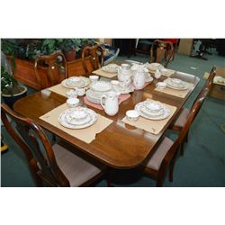 Regency style mahogany double pedestal dining table with matched grain top and two large insert leaf