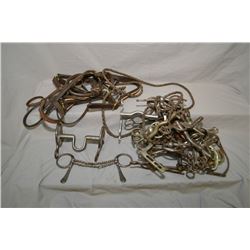 Selection of horse bits and leathers etc.