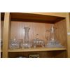Image 2 : Shelf lot containing a large selection of cut and pressed crystal including pitchers, vases, dishes