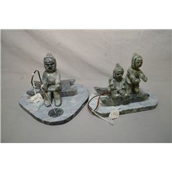 Two Inuit soapstone carvings including ice fishing off a sled and two children on a sleight 6  in le