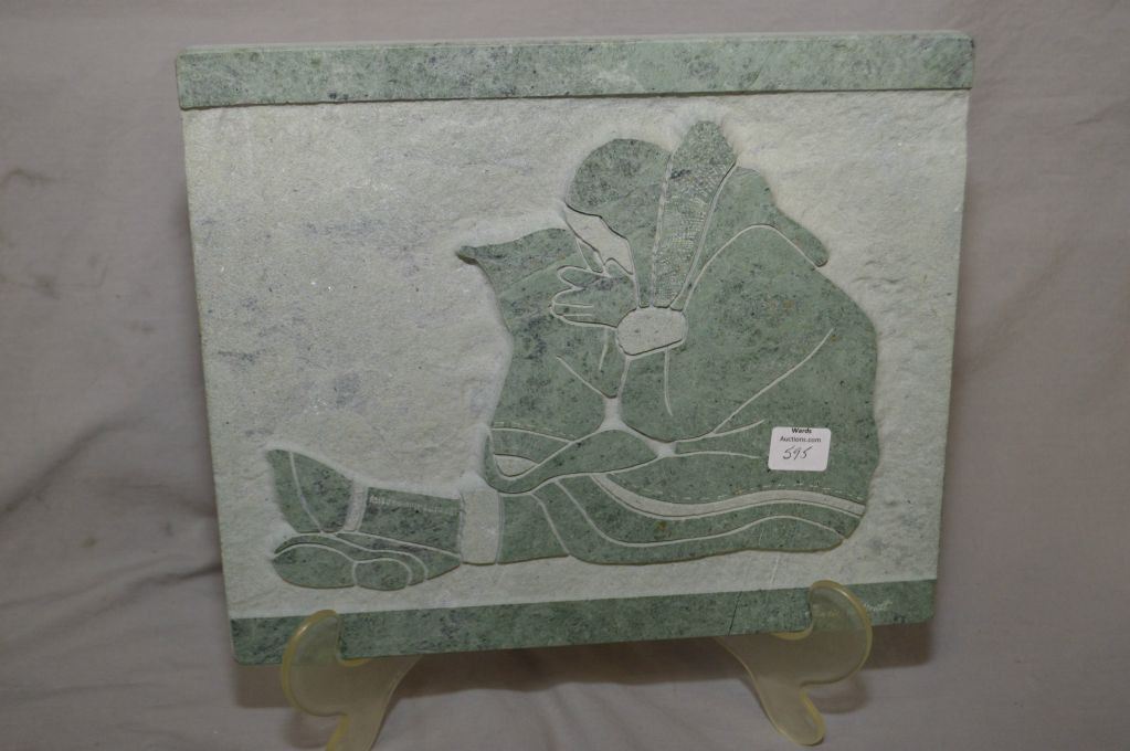Carved soapstone plaque featuring an Inuit mother and child signed by