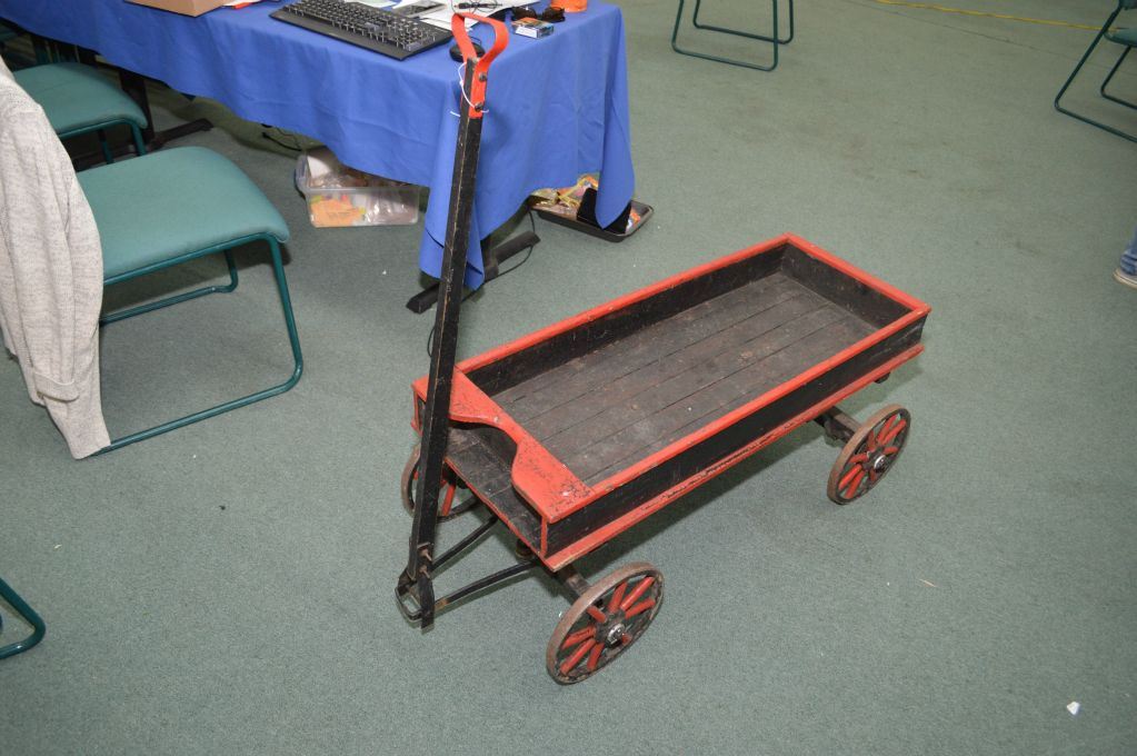 Antique wooden wagon with metal wheels