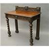 Image 1 : An Edwards & Roberts oak hall table, carved with masks and arabesques, with galleried back and fi...