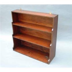 # A Regency mahogany stepped-fronted open bookcase of three shelves, brass line-inlaid (brass gal...