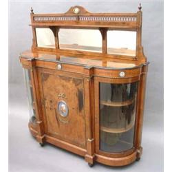 A Victorian walnut and ebonised credenza, having gilt-bronze mounts and inset Sevres style plaque...