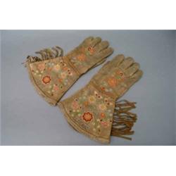 A pair of North American Indian buckskin gloves, floral-embroidered, north-east woodland tribe, p...