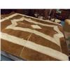 Image 2 : LARGE COW HIDE PATCHWORK RUG - 96 X 64" - SEEN FITTING ON A QUEEN BED IN PICTURE - STITCHED WITH