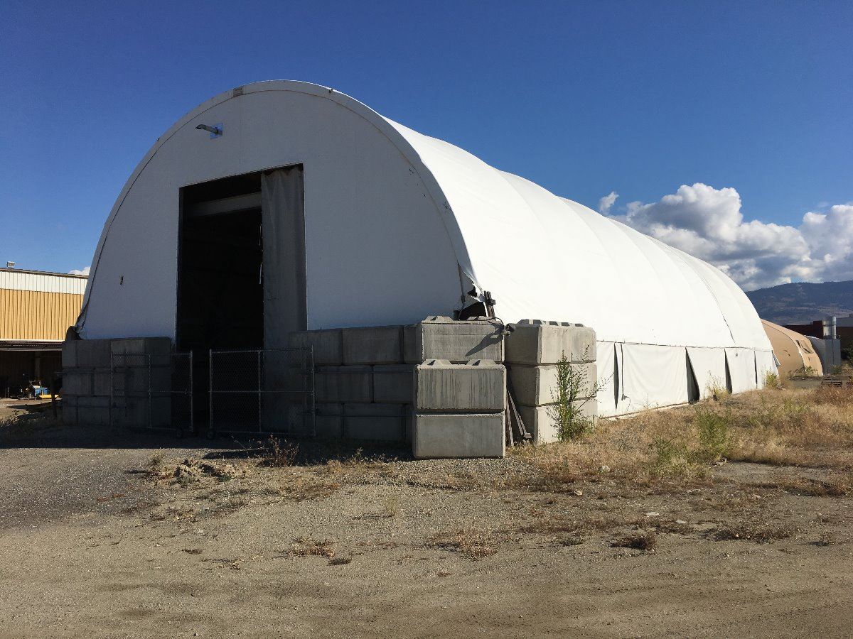 Approximately 45 X 100 Metal Framed Canvas Covered Quonset Hut With Cement Blocks Two Overhad Able Auctions