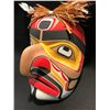 Image 2 : KWAG-UILTH 'HAWK MAN' MASK BY JAY BRABANT,  MASK FEATURES CEDAR BARK HAIR AND FEATHERS.
