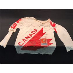 LOT OF 2 SPORTS COLLECTABLES INC.: 1976 CANADA CUP #9 JERSEY SIGNED BY BOBBY HULL AND OTHER TEAM