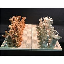 ASIAN THEME OVERSIZED CHESS SET WITH FIGURES RANGING FROM 8" TO 12" TALL.