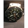 Image 1 : HUBLOT WALL MOUNT WRIST WATCH CLOCK.  MEASURES 20" TALL X 19" WIDE