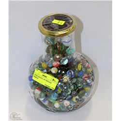 LIDDED JAR FULL OF VINTAGE MARBLES