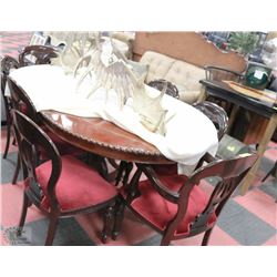ROUND WALNUT DINING TABLE WITH CARVED CLAWFEET