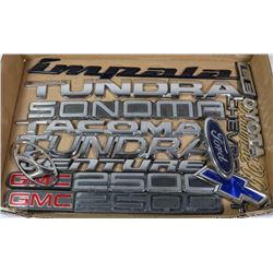 FLAT OF MIXED CAR EMBLEMS AND DECALS