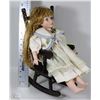 Image 1 : DECORATIVE PORCELAIN DOLL IN ROCKING CHAIR