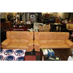 PEACH COLOURED LEATHER LIKE COUCH AND LOVE SEAT