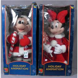 A PAIR OF HOLIDAY ANNIMATION MICKEY AND MINNIE DOLS