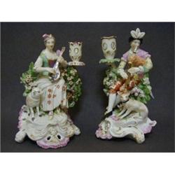 A PAIR OF DERBY BOCAGE CANDLESTICKS, c.1776, figure of Shepherdess and Shepherd, (some old restor...