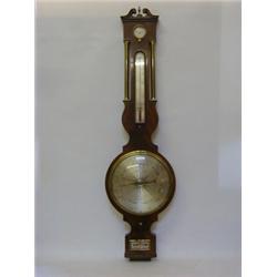 A MAHOGANY WHEEL BAROMETER, first half of the 19th Century, swan neck pediment flanking a brass f...