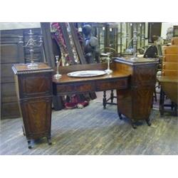 A REGENCY MAHOGANY SIDEBOARD, tapered twin pedestals, gadroon cornice over geometric panelled dra...