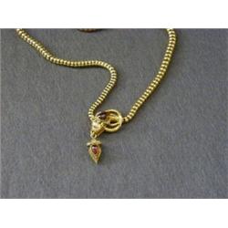 A MID VICTORIAN CHOKER NECK CHAIN, high carat gold, front clasp formed as a serpents head, set ca...