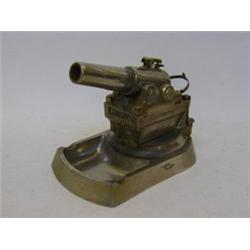 A NOVELTY TABLE CIGARETTE LIGHTER, first half of the 20th Century, chromium plated in the form of...