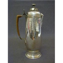 AN ASPREY & CO CAFE AU LAIT POT, hammered finish, mother of pearl inset cover finial, cane covere...