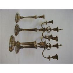 A SET OF FOUR SHEFFIELD PLATED CANDLESTICKS, late 19th Century, batswing fluted oval bases, taper...