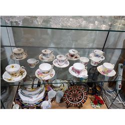 COLLECTION OF 9 TEACUPS AND CREAM AND SUGAR