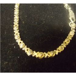 BRACELET - 5 GENUINE DIAMONDS IN STERLING SILVER SETTING - STERLING SILVER FASHIONED IN HUGS AND KIS