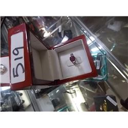 RING -1.6CT SOLITARE RED RUBY AND 2 WHITE SAPPHIRE CROSS DESIGN ON THE SHOULDERS -  ALL SET IN STERL