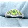 Image 1 : Genuine Peridot Ring accented with White Sapphire gemstones.