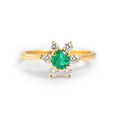 An Emerald and Diamond Gold Ring, by Tiffany & Co.